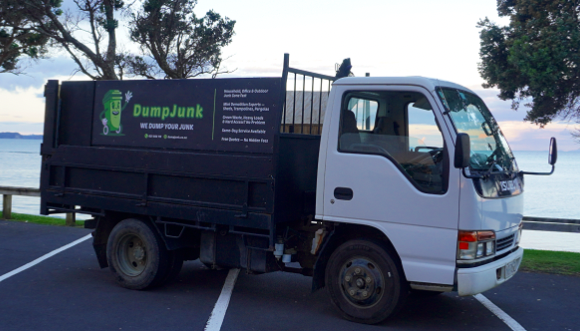 DumpJunk truck parked by the coast